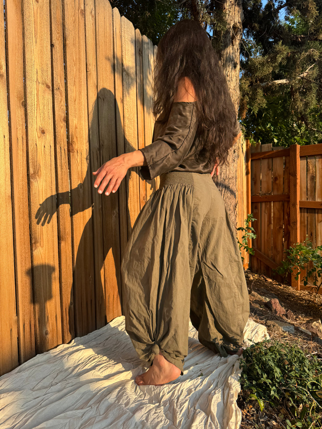 The Italian Pants in Olive styled with The Ease Tee in soft evening light.